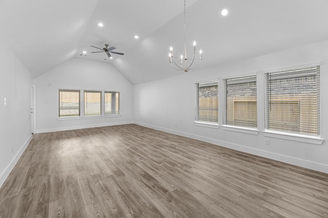 21318 Oakley Claremont Ct, Magnolia, TX 77355 - unfurnished living room featuring vaulted ceiling, a chandelier, recessed lighting, baseboards, and a ceiling fan