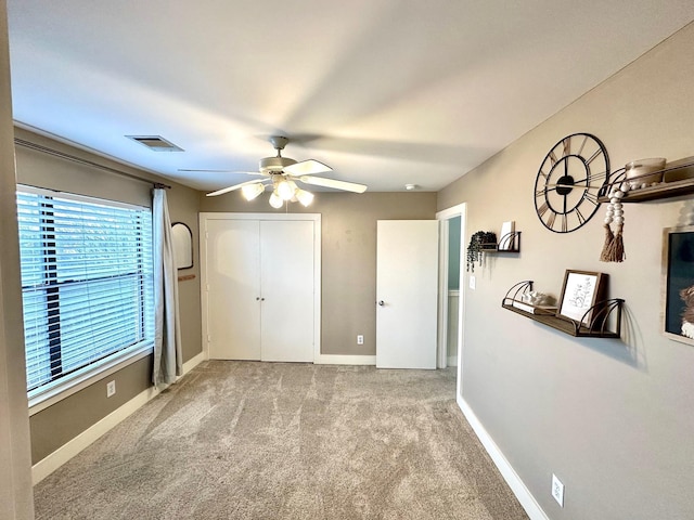 5018 Darling St, Houston, TX 77007 - unfurnished bedroom with carpet, a closet, baseboards, and a ceiling fan