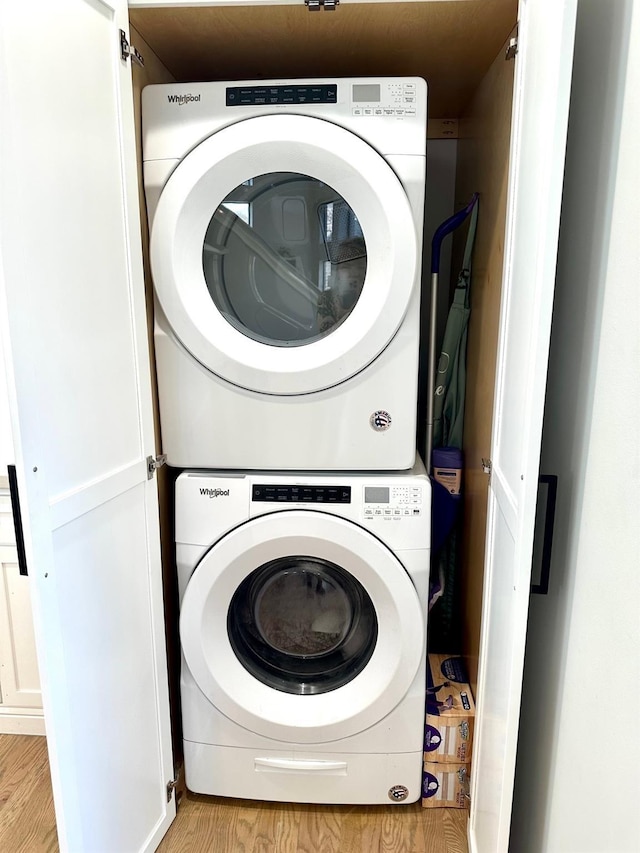 5018 Darling St, Houston, TX 77007 - washroom featuring estacked washer and dryer and light wood-style floors