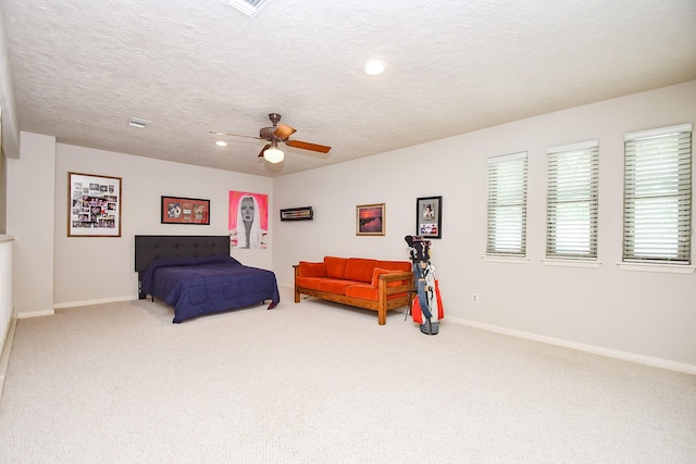 8028 Oakwood Forest Dr, Houston, TX 77040 - bedroom featuring carpet flooring, baseboards, a ceiling fan, recessed lighting, and a textured ceiling