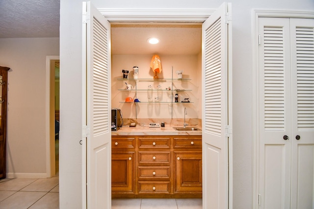 8028 Oakwood Forest Dr, Houston, TX 77040 - indoor bar with light tile patterned flooring and recessed lighting
