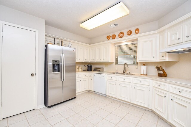 8028 Oakwood Forest Dr, Houston, TX 77040 - kitchen with stainless steel refrigerator with ice dispenser, dishwasher, a sink, under cabinet range hood, and light countertops