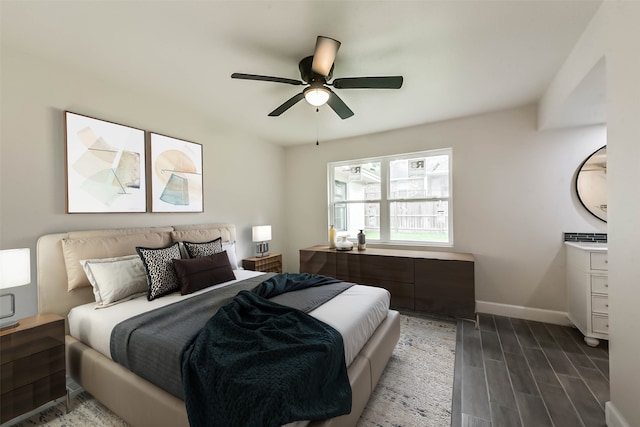 9096 N Comanche Cir, Willis, TX 77378 - bedroom featuring wood finished floors, baseboards, and ceiling fan