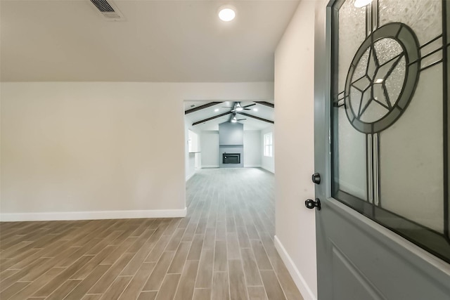 9096 N Comanche Cir, Willis, TX 77378 - hall with baseboards, lofted ceiling, and wood finished floors