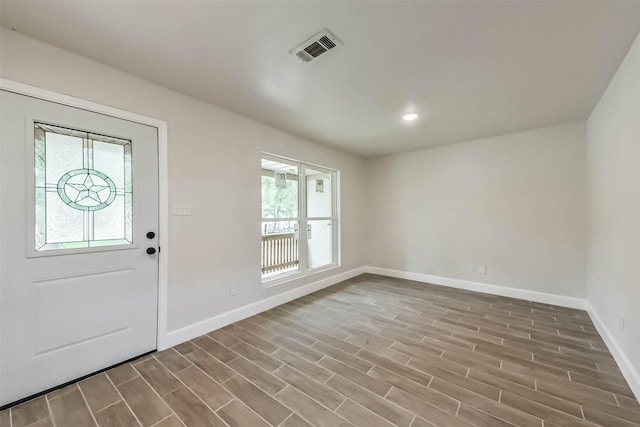9096 N Comanche Cir, Willis, TX 77378 - entrance foyer featuring baseboards, wood finished floors, and recessed lighting