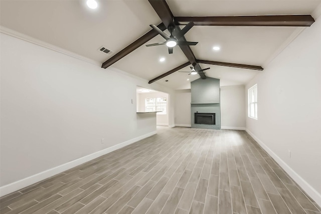 9096 N Comanche Cir, Willis, TX 77378 - unfurnished living room featuring a ceiling fan, recessed lighting, plenty of natural light, baseboards, and wood finished floors