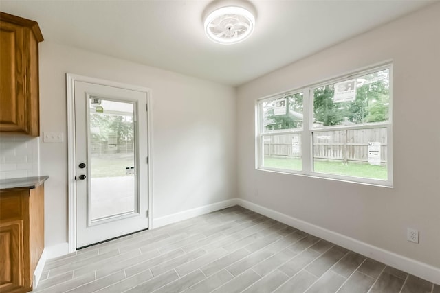 9096 N Comanche Cir, Willis, TX 77378 - doorway to outside featuring baseboards