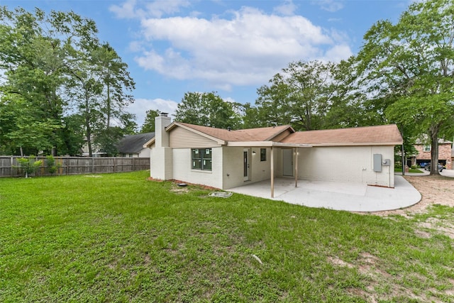 9096 N Comanche Cir, Willis, TX 77378 - rear view of house featuring a patio area, brick siding, and a chimney