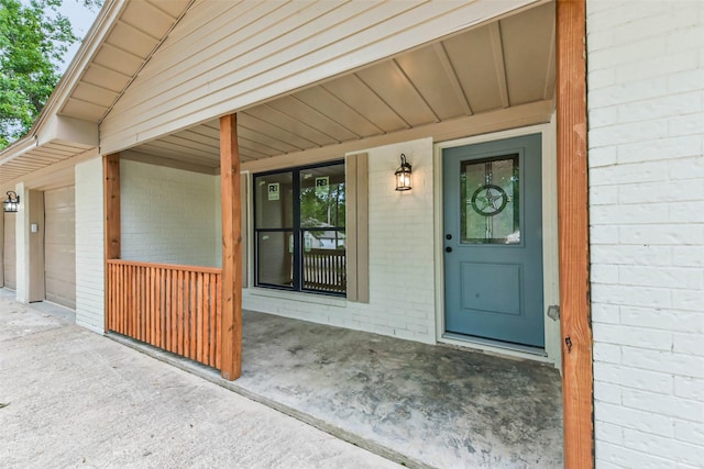 9096 N Comanche Cir, Willis, TX 77378 - entrance to property featuring brick siding and a porch
