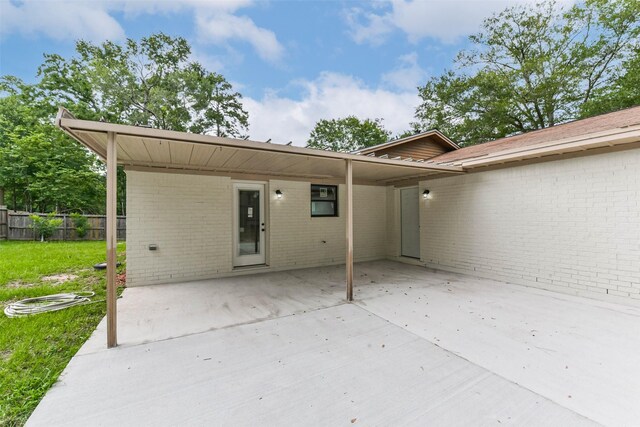 9096 N Comanche Cir, Willis, TX 77378 - rear view of house featuring brick siding