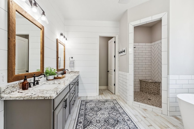 1935 Invermere Dr, Spring, TX 77386 - bathroom featuring double vanity, a tile shower, and a soaking tub