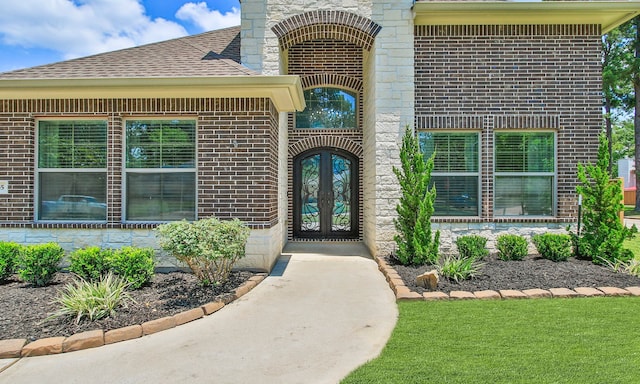 1935 Invermere Dr, Spring, TX 77386 - doorway to property with french doors, brick siding, roof with shingles, and stone siding