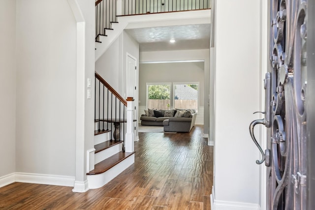 1935 Invermere Dr, Spring, TX 77386 - foyer with wood finished floors, stairway, and arched walkways