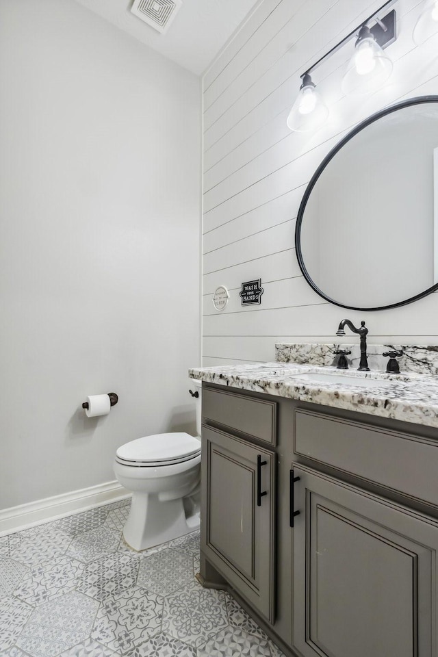 1935 Invermere Dr, Spring, TX 77386 - bathroom featuring vanity, tile patterned flooring, and wooden walls