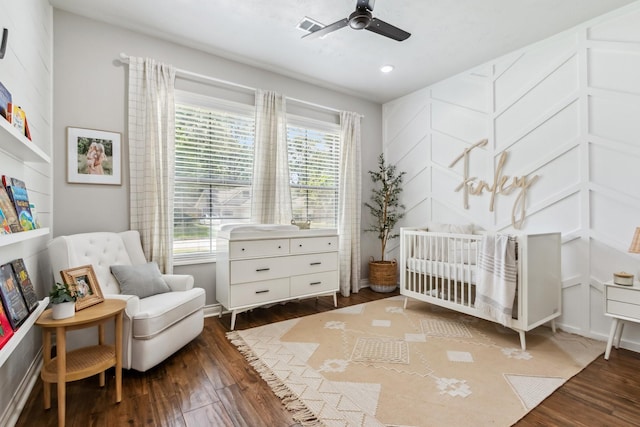 1935 Invermere Dr, Spring, TX 77386 - bedroom with dark wood finished floors, a nursery area, recessed lighting, and a ceiling fan