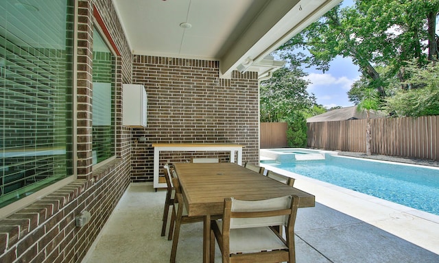 1935 Invermere Dr, Spring, TX 77386 - view of swimming pool with a fenced backyard, a pool with connected hot tub, and a patio