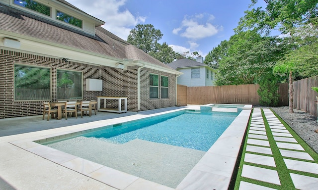 1935 Invermere Dr, Spring, TX 77386 - view of pool with a fenced backyard, a pool with connected hot tub, and a patio area