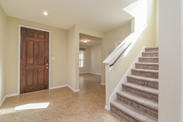13018 Foxwood Creek Ln, Houston, TX 77044 - tiled foyer entrance featuring stairway, baseboards, and recessed lighting