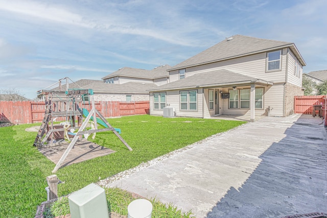 13018 Foxwood Creek Ln, Houston, TX 77044 - rear view of property featuring a playground, central AC, a patio area, ceiling fan, and driveway