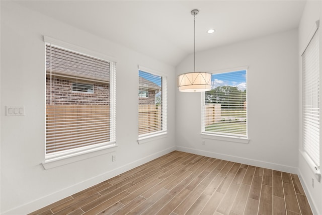 18232 Saffron Sun St, Conroe, TX 77302 - unfurnished dining area featuring baseboards, wood finished floors, and recessed lighting