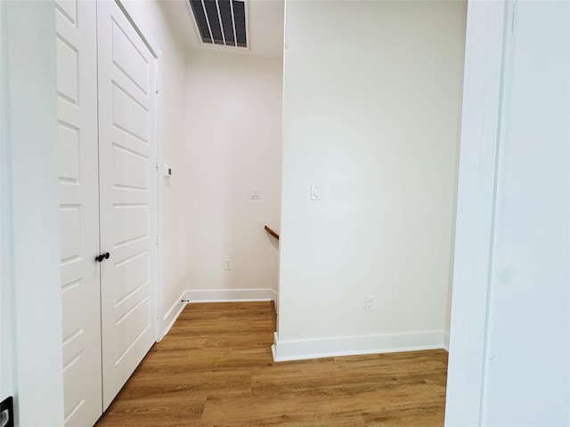 1307 71st St Unit A, Houston, TX 77011 - hall featuring light wood-style flooring and an upstairs landing