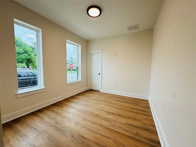 1307 71st St Unit A, Houston, TX 77011 - unfurnished room featuring plenty of natural light and wood finished floors