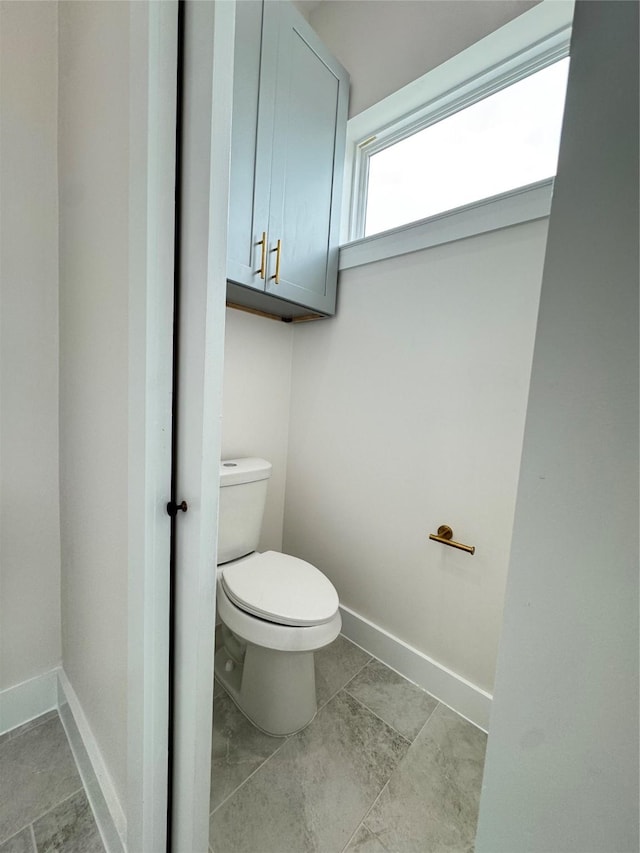 1307 71st St Unit A, Houston, TX 77011 - bathroom featuring toilet and baseboards