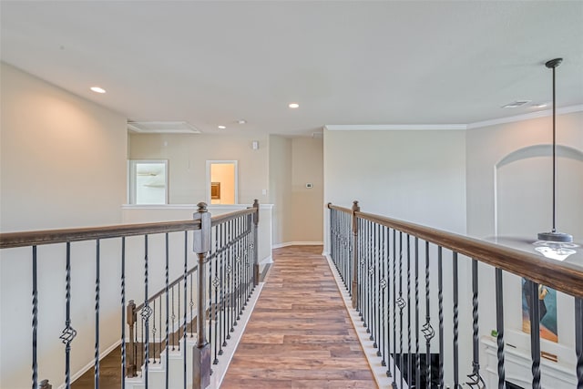 10010 St Romain Dr, Katy, TX 77494 - hall with attic access, recessed lighting, ornamental molding, wood finished floors, and baseboards