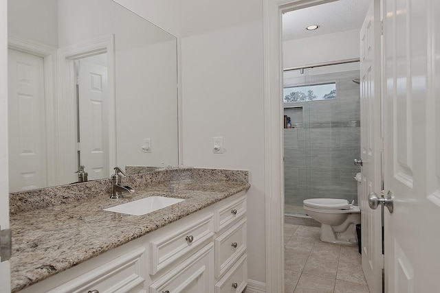 7 Spindrift Pl, The Woodlands, TX 77381 - bathroom featuring vanity, a shower stall, toilet, and tile patterned flooring