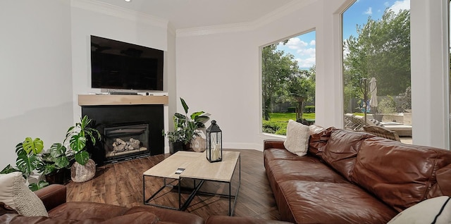 7 Spindrift Pl, The Woodlands, TX 77381 - living area featuring ornamental molding, wood finished floors, a fireplace, and baseboards