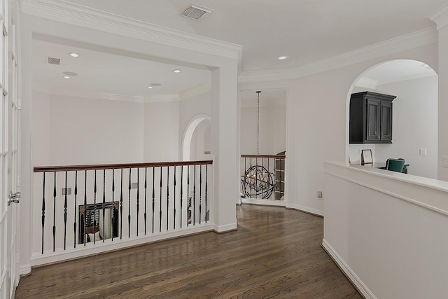 7 Spindrift Pl, The Woodlands, TX 77381 - hall featuring wood finished floors, recessed lighting, baseboards, crown molding, and arched walkways