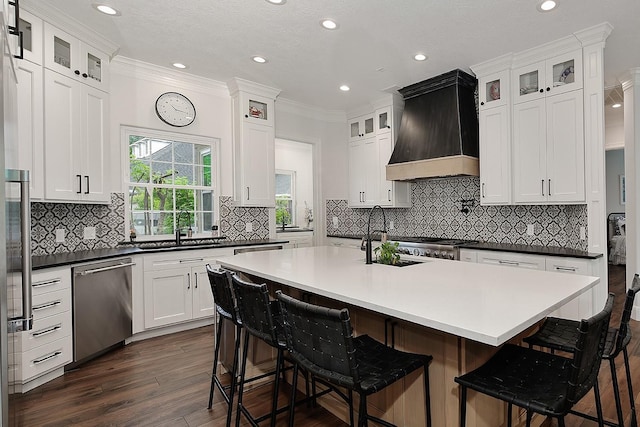 7 Spindrift Pl, The Woodlands, TX 77381 - kitchen with stainless steel dishwasher, custom range hood, a sink, dark wood-style flooring, and crown molding