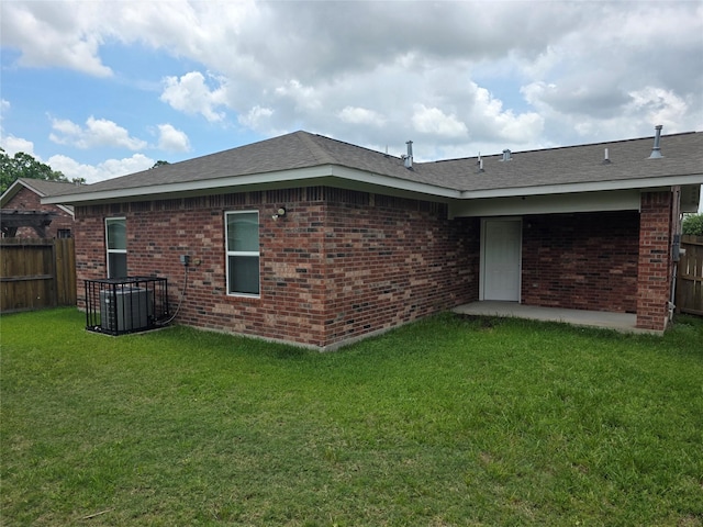 8407 Shady Vista Ct, Houston, TX 77028 - rear view of house with cooling unit and brick siding