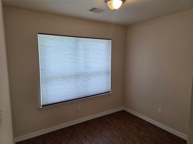 8407 Shady Vista Ct, Houston, TX 77028 - unfurnished room with dark wood-style flooring and baseboards