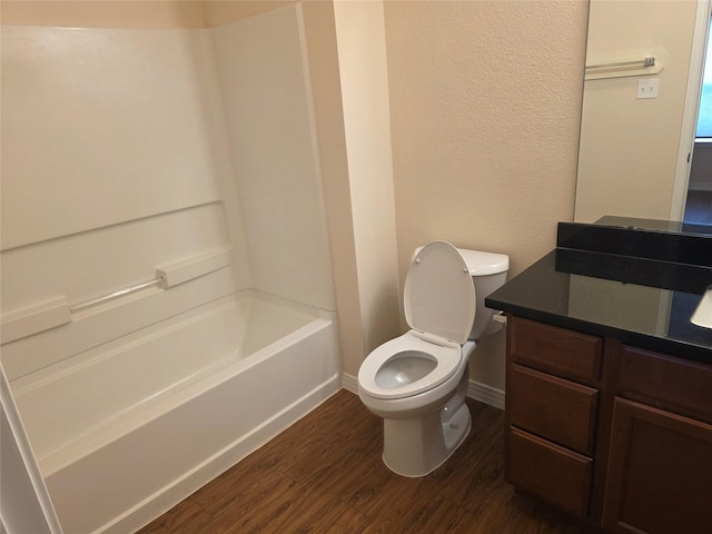 8407 Shady Vista Ct, Houston, TX 77028 - bathroom with wood finished floors, vanity, toilet, baseboards, and shower / bath combination