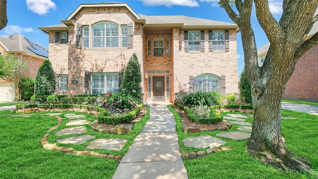 3903 Livingston Lake Ct, Pearland, TX 77581 - view of front facade with brick siding and a front lawn