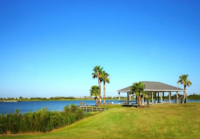 22906 Miramar St, Galveston, TX 77554 - view of property's community featuring a gazebo, a lawn, and a water view