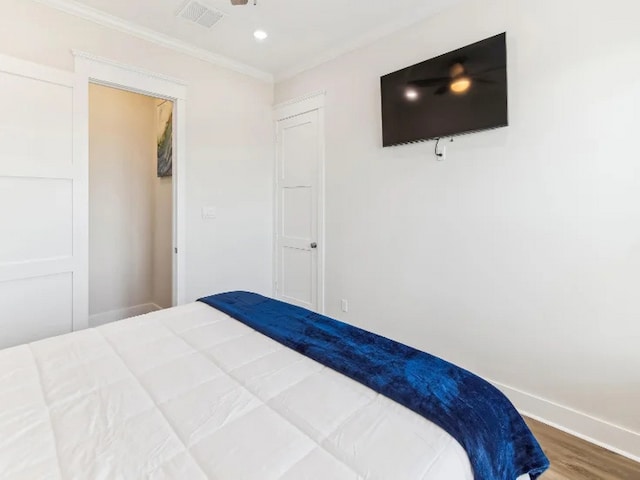22906 Miramar St, Galveston, TX 77554 - bedroom featuring wood finished floors, baseboards, crown molding, and recessed lighting
