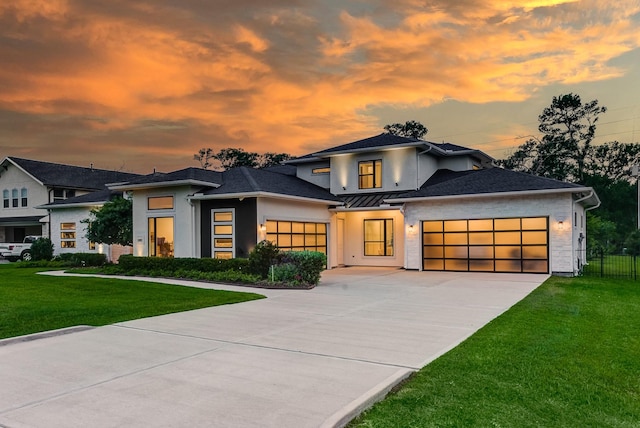 1002 Royal Lakes Manor Blvd, Richmond, TX 77469 - view of front facade with an attached garage, stucco siding, concrete driveway, a standing seam roof, and metal roof