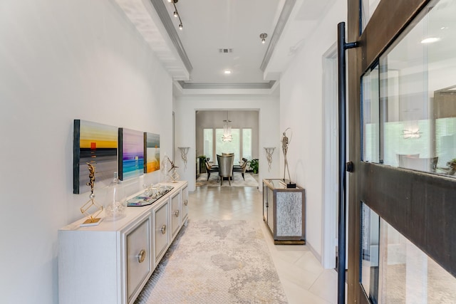 1002 Royal Lakes Manor Blvd, Richmond, TX 77469 - hallway with crown molding, light tile patterned flooring, a chandelier, and baseboards