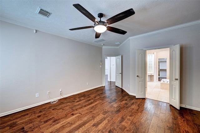 21814 Canton Pass Ln, Katy, TX 77450 - empty room featuring ornamental molding, wood finished floors, a ceiling fan, baseboards, and a textured ceiling
