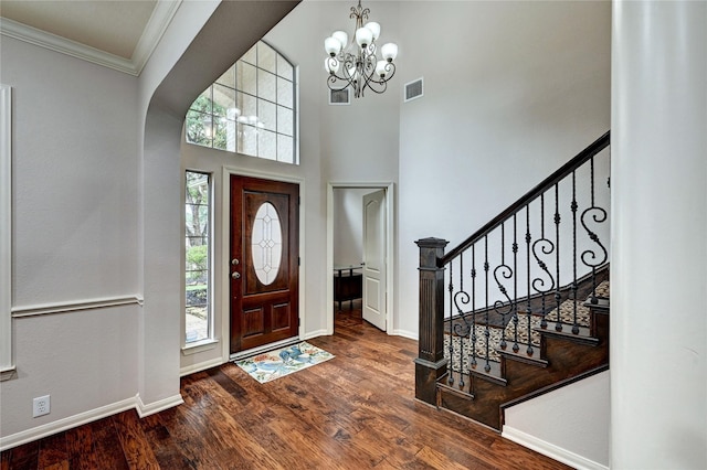 21814 Canton Pass Ln, Katy, TX 77450 - foyer entrance with a chandelier, wood finished floors, ornamental molding, baseboards, and stairs
