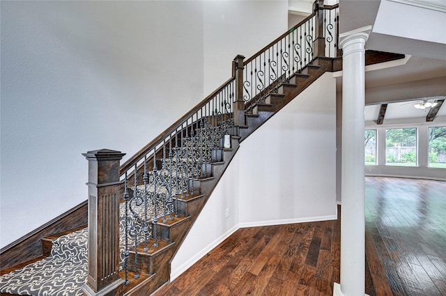 21814 Canton Pass Ln, Katy, TX 77450 - stairs with hardwood / wood-style floors, baseboards, decorative columns, and a high ceiling