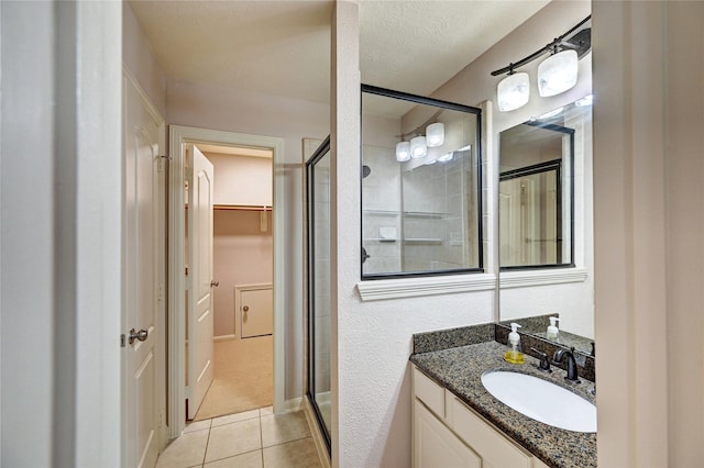 21814 Canton Pass Ln, Katy, TX 77450 - full bath with a shower stall, vanity, tile patterned flooring, and a spacious closet