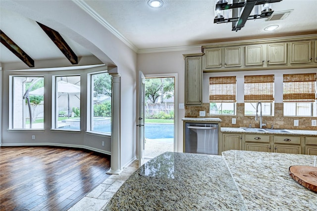 21814 Canton Pass Ln, Katy, TX 77450 - kitchen featuring dishwasher, a sink, light stone counters, decorative backsplash, and ornamental molding