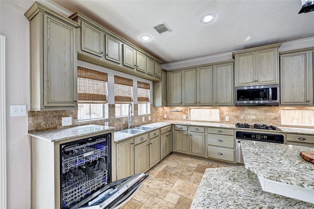 21814 Canton Pass Ln, Katy, TX 77450 - kitchen with stainless steel appliances, a sink, decorative backsplash, stone tile flooring, and light stone counters