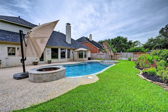 21814 Canton Pass Ln, Katy, TX 77450 - view of pool featuring a pool with connected hot tub, a patio, and a fire pit