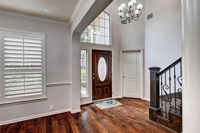 21814 Canton Pass Ln, Katy, TX 77450 - entryway featuring a chandelier, wood finished floors, baseboards, crown molding, and stairway