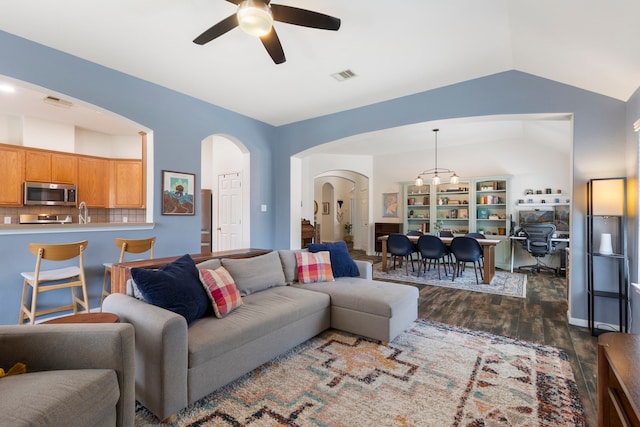 4613 Meridian Park Dr, Pearland, TX 77584 - living room with arched walkways, lofted ceiling, a ceiling fan, dark wood-style flooring, and an office area