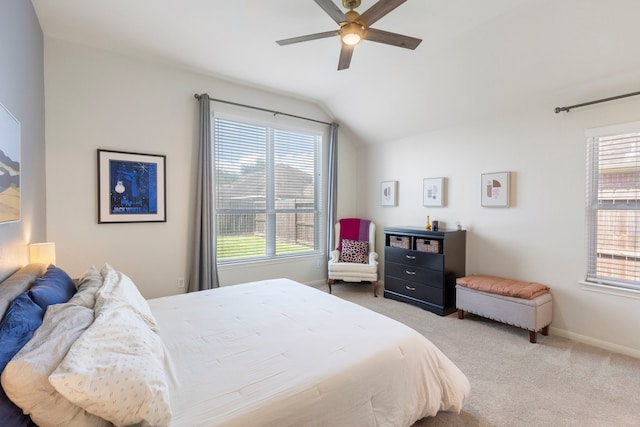4613 Meridian Park Dr, Pearland, TX 77584 - carpeted bedroom featuring lofted ceiling, multiple windows, baseboards, and a ceiling fan